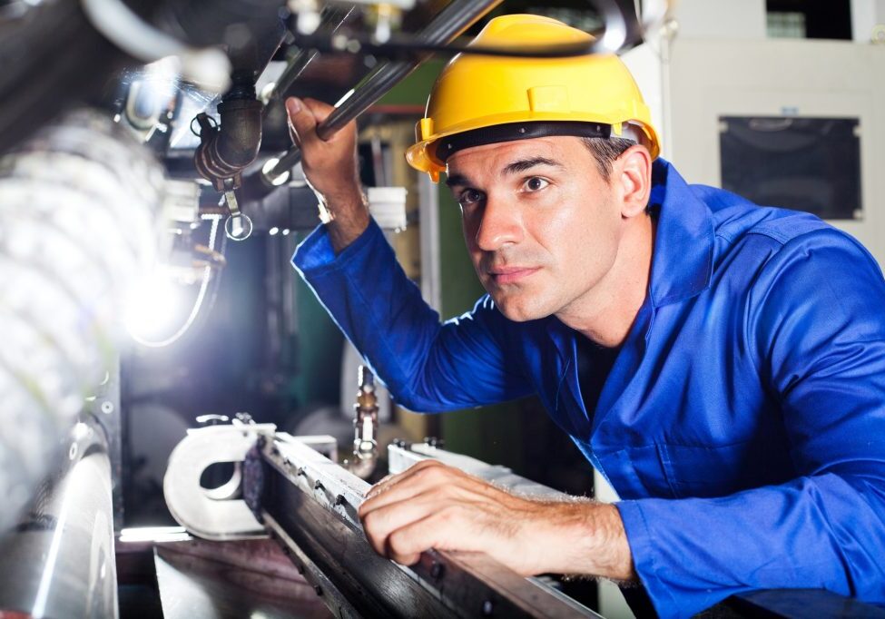 modern machine operator working in factory