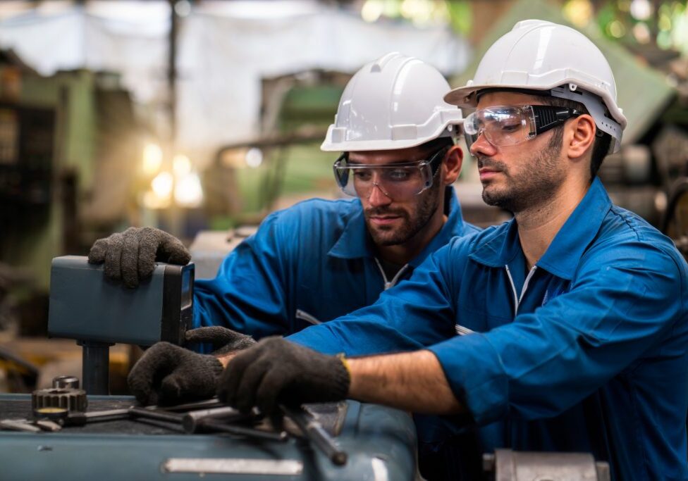 Engineers and skilled technicians are maintaining machinery. Professional technicians are working in industrial plants.